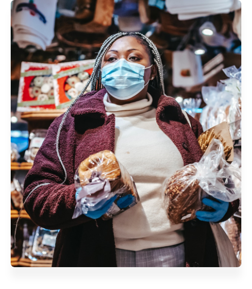 woman with facemask and groceries